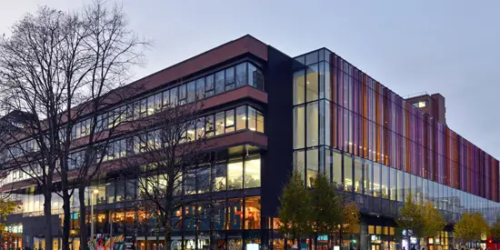 The AMBS building on Oxford Road in Manchester in the evening light