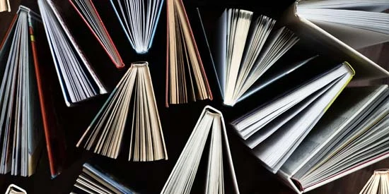 An overhead view of lots of open books