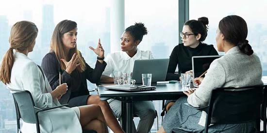 A group of business women in a meeting