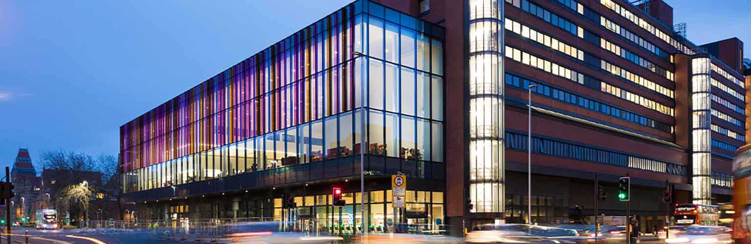 The Alliance Manchester Business School building in the evening