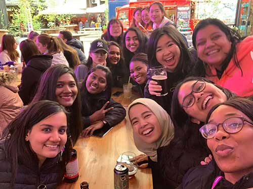 Payal Mehta at an outdoor bar with a group of friends