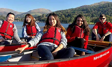 Payal Mehta and some student friends on rowing boats at Brathay in The Lake District