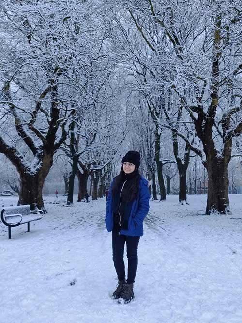Aditi Verma standing on a snow covered path