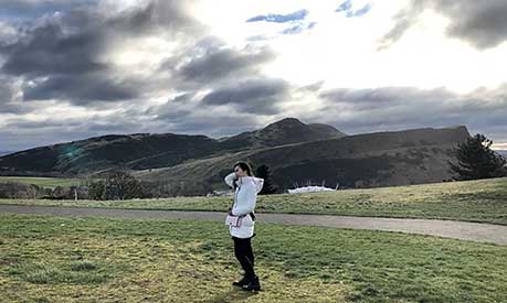 Amanda Kusmajaya with Arthur's Seat, Edinburgh in the background