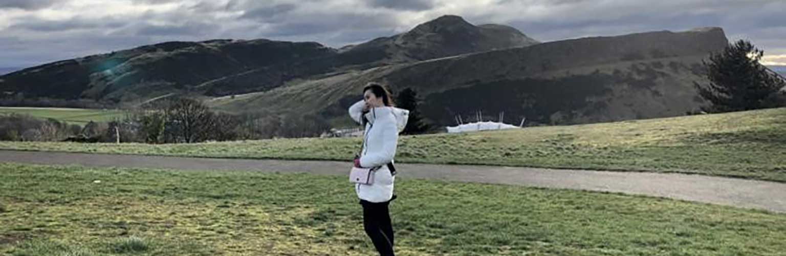 Amanda Kusmajaya with Arthur's Seat, Edinburgh in the background