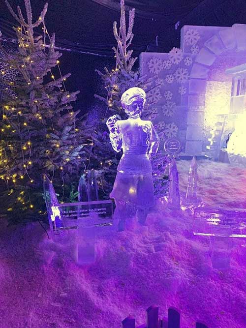 A Christmas tree and ice sculpture