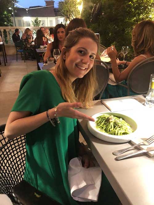 Camille Hanotte at a restaurant with a plate of pasta