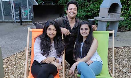 Aditi Verma sat in a deck chair with two other student friends