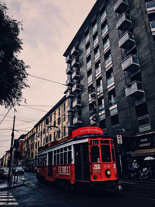 A red tram in Milan
