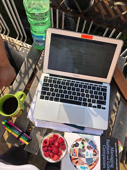 An open laptop on a balcony