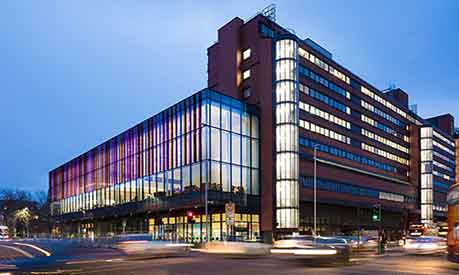 The Alliance Manchester Business School building in the evening