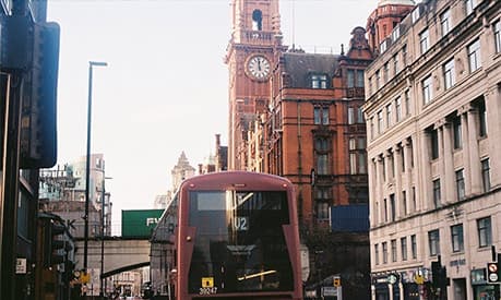 A view of Oxford Road looking towards to the city centre  - showing the V2 bus in the foreground