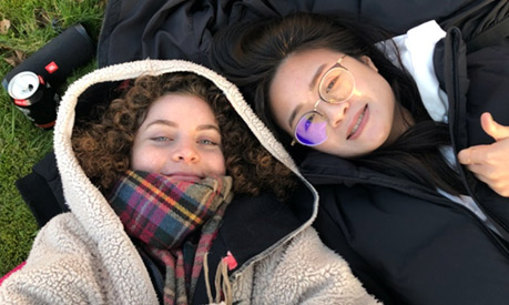 friends lay on grass