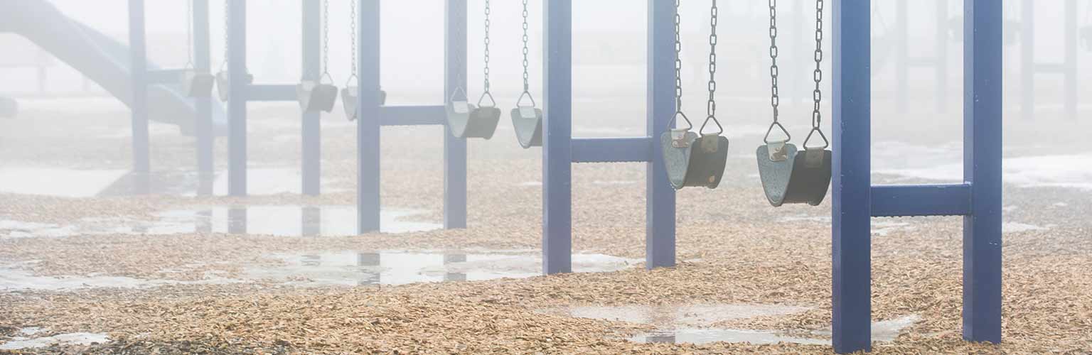 a swing set on a rainy day