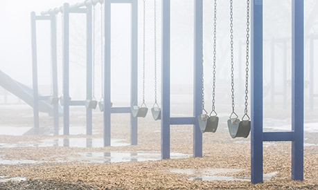 a swing set on a rainy day