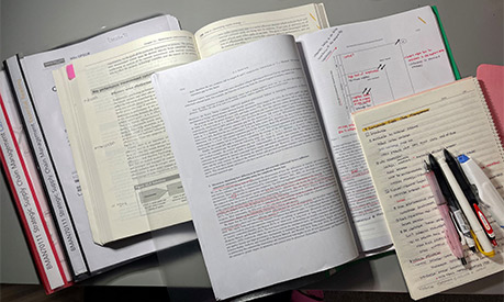 A row of books on a desk