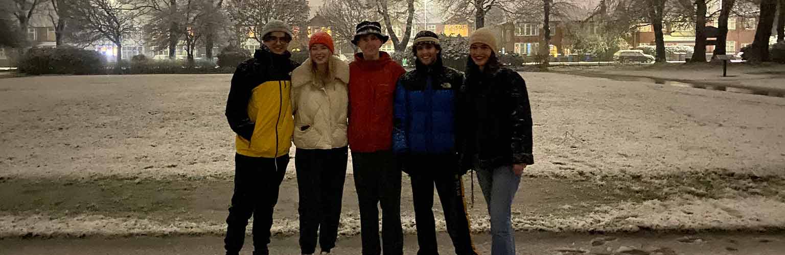 Amy Wells and her friends in a park in the snow