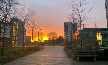 A view of the Executive Education Centre and Trinity High School in Manchester during a sunset