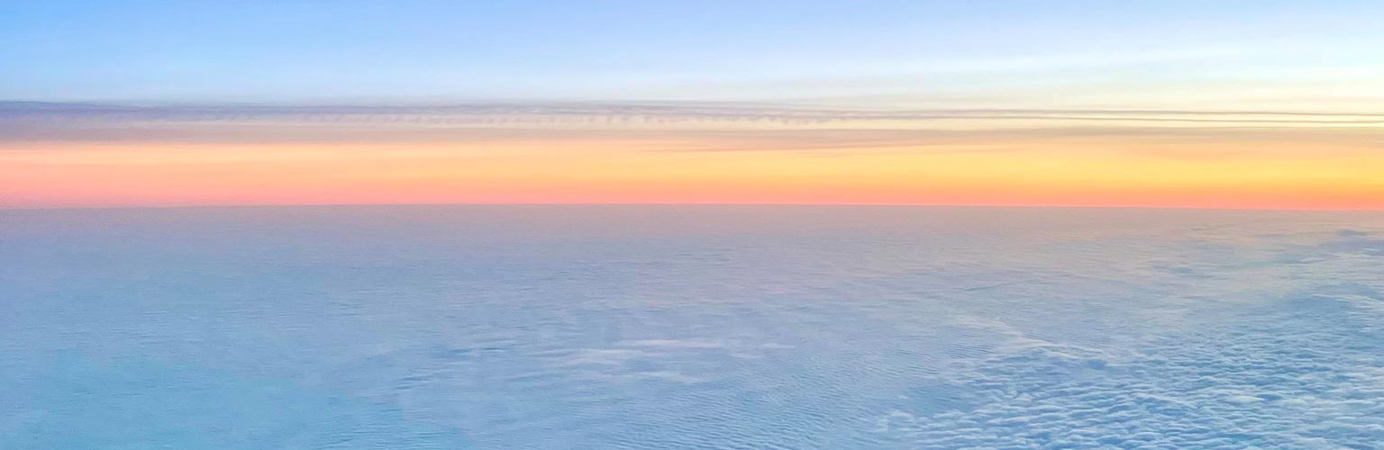 A view of a sunset from an airplane window