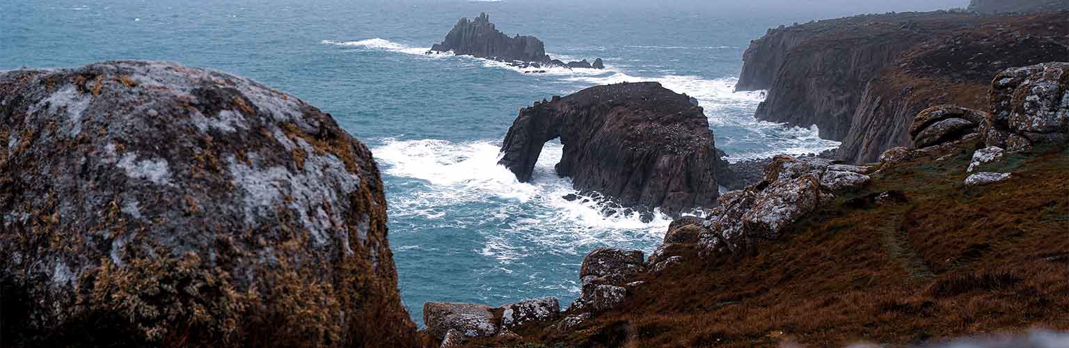 A view of the ocean with grey skies