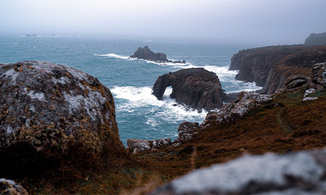 A view of the ocean with grey skies 