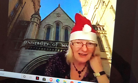 A zoom call with a tutor in a santa hat