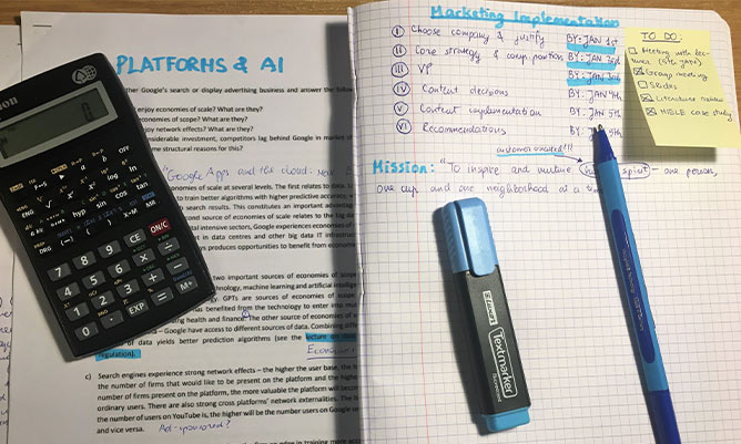 A calculator on top of a textbook 