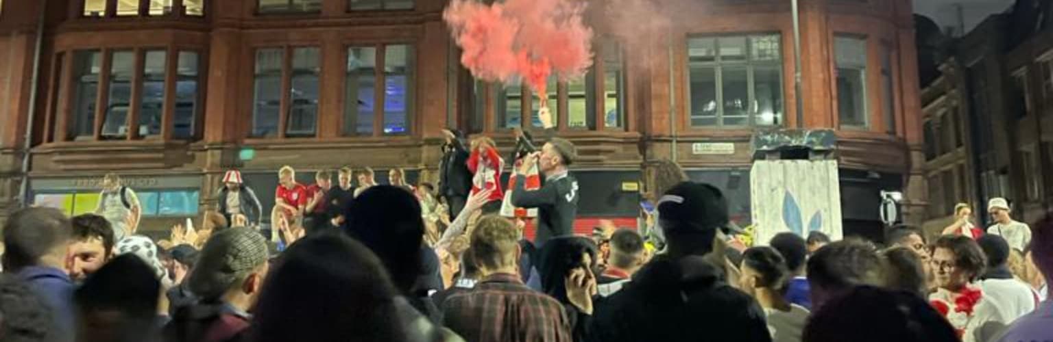 A picture of England fans together in Stephenson Square in Manchester