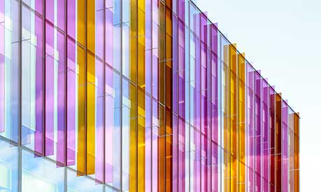 A photo of the multicoloured glass fins above the entrance to the Alliance MBS building