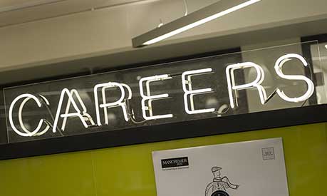 A neon light careers sign