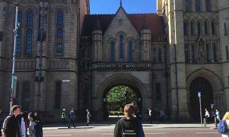 Madalina Ifrim in front of the University of Manchester arch on Oxford Road