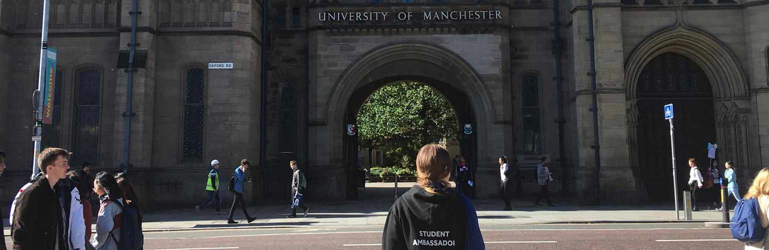 Madalina Ifrim in front of the University of Manchester arch on Oxford Road