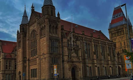 The University of Manchester building at night