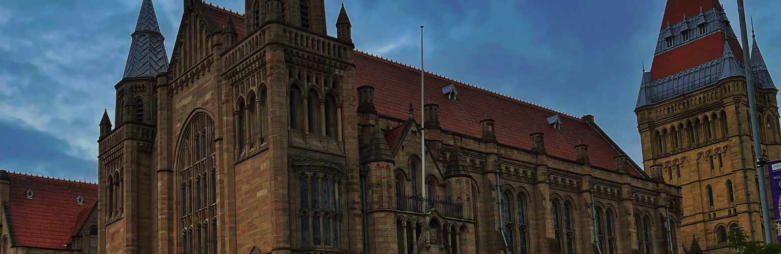 The University of Manchester building at night