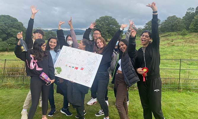 Eleni Chliapa and her friends outside celebrating in the Lake District