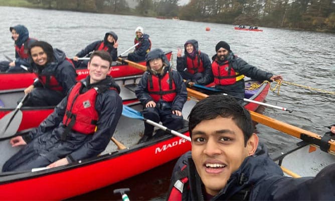 A group of students in kayaks in the Lake District