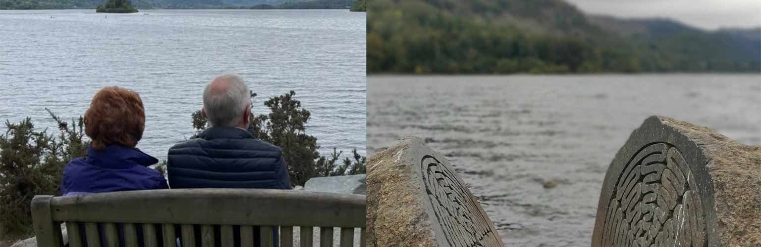 A picture of a couple looking out across the Lake District