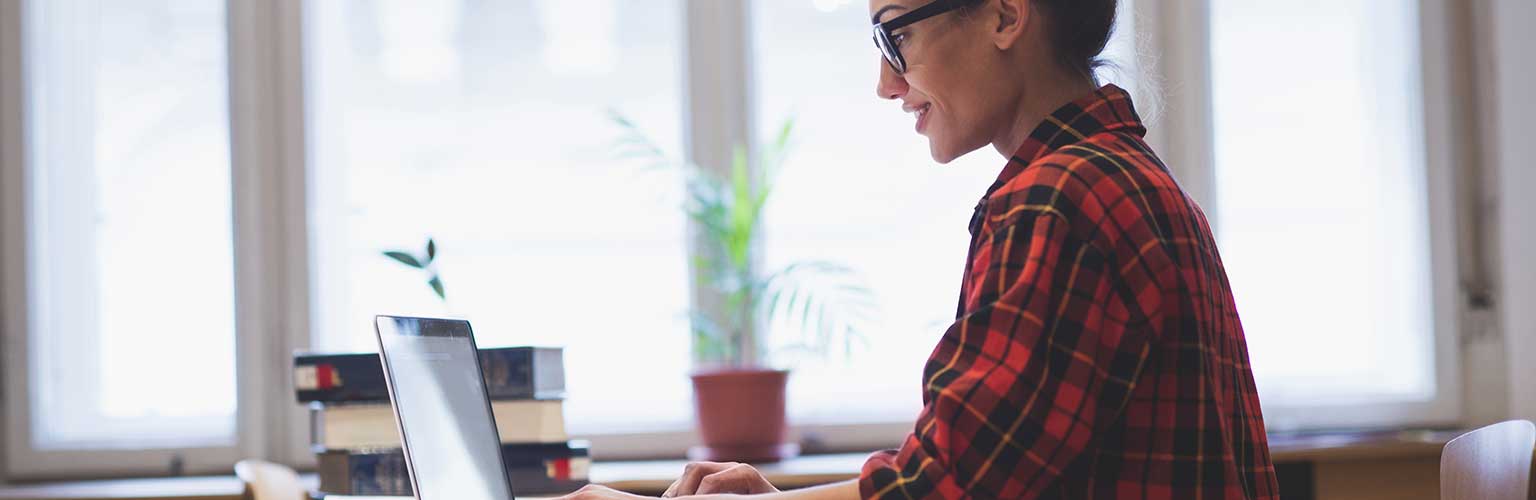 A student working on a laptop