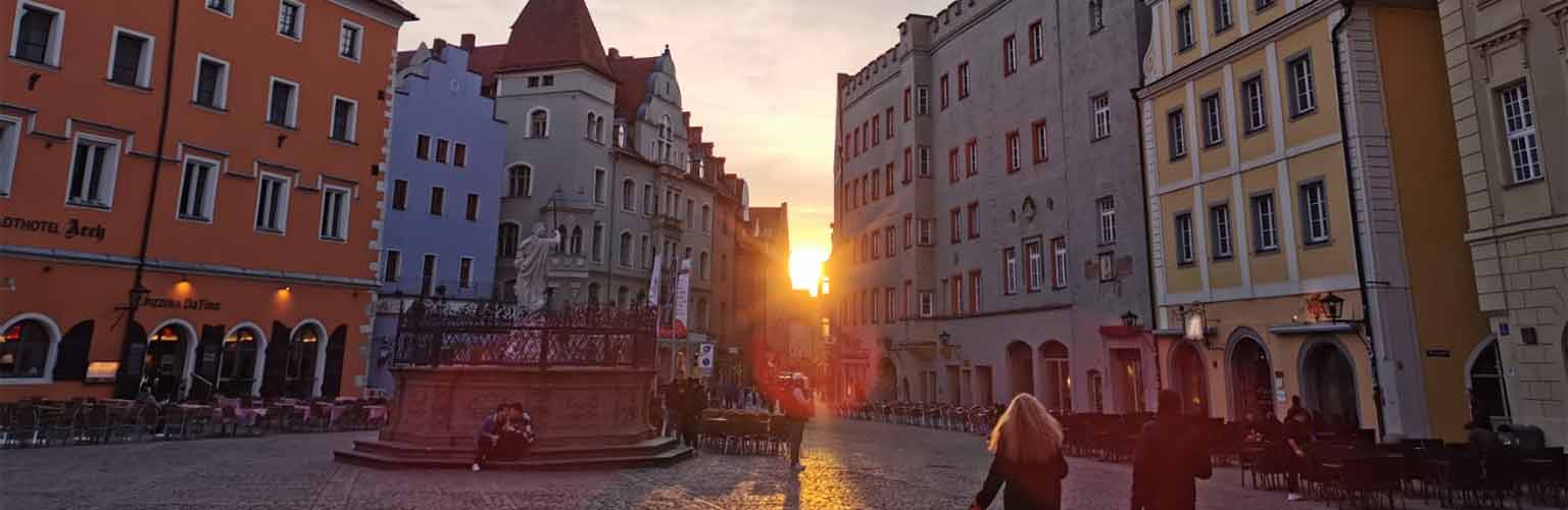 An Old Town square in Germany during the sunset