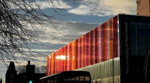 A view of the Alliance Manchester Business School building looking down Oxford Street