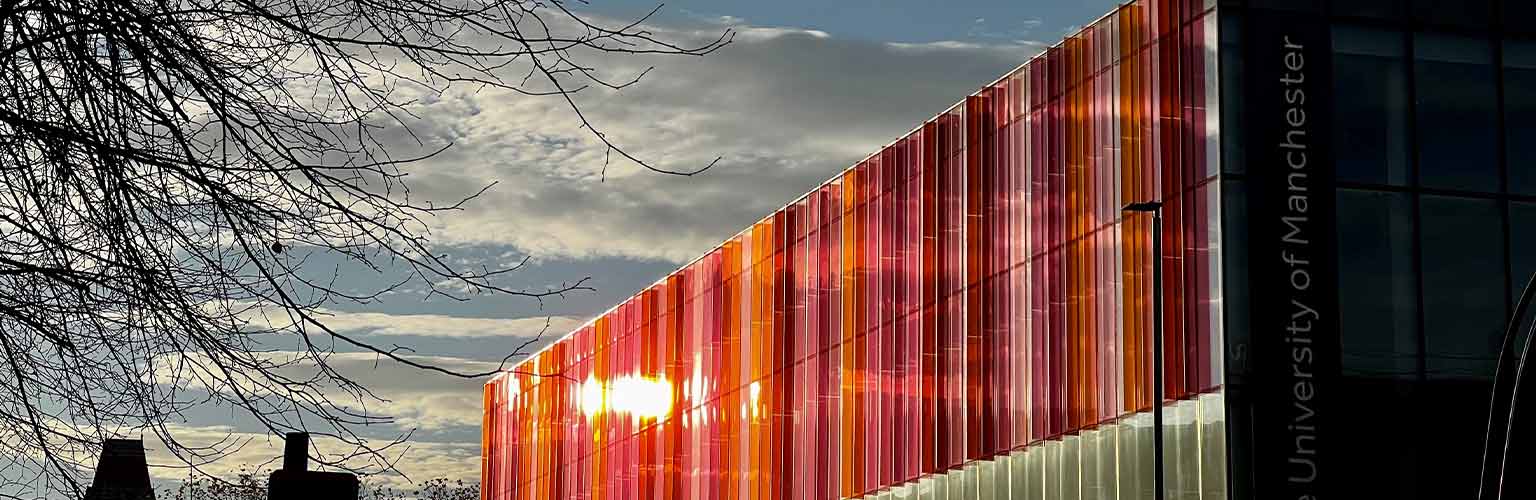 A view of the Alliance Manchester Business School building looking down Oxford Street