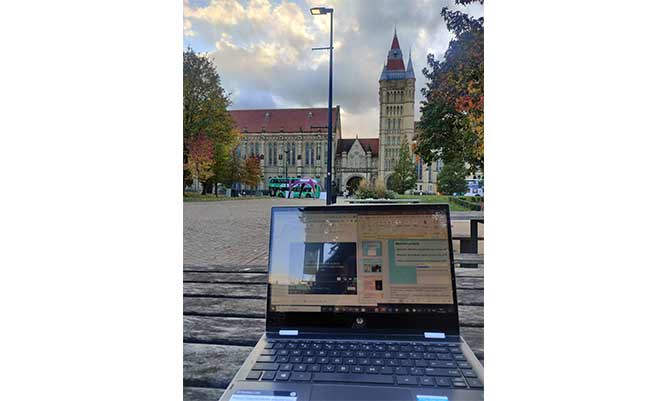 A laptop on a bench in Brunswick Park