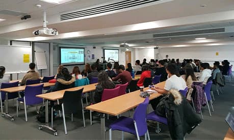 A workshop being held at Alliance Manchester Business School in a full classroom