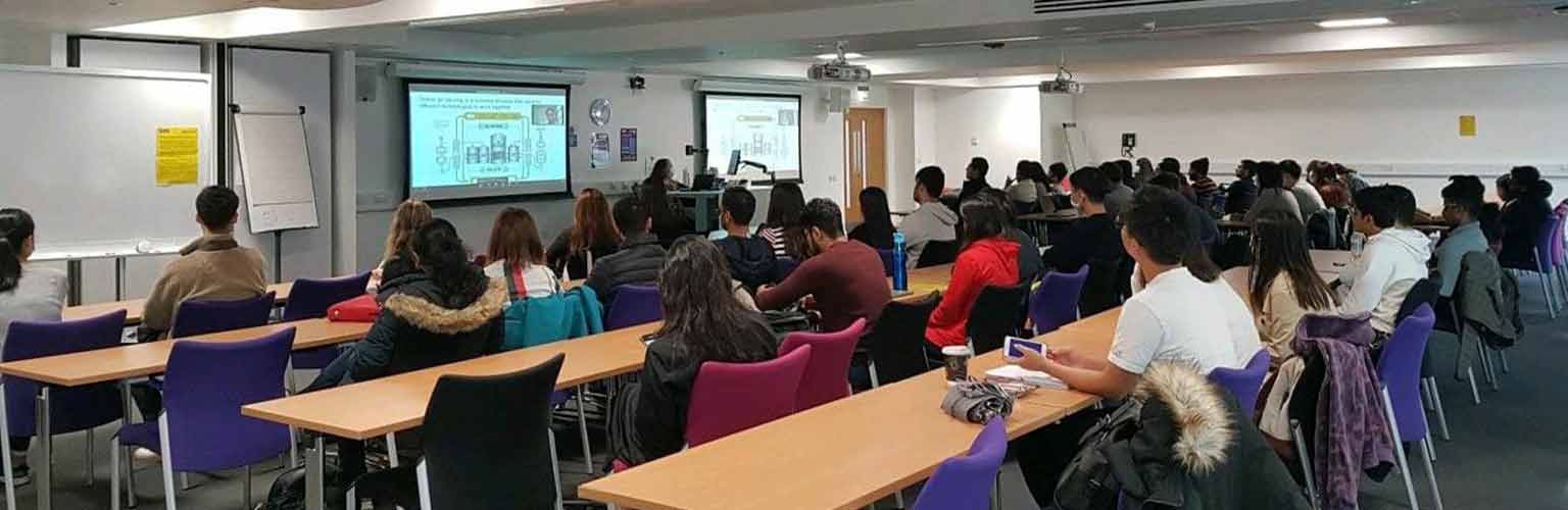 A workshop being held at Alliance Manchester Business School in a full classroom