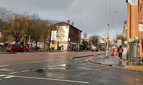 A view down a Manchester road with grey sky