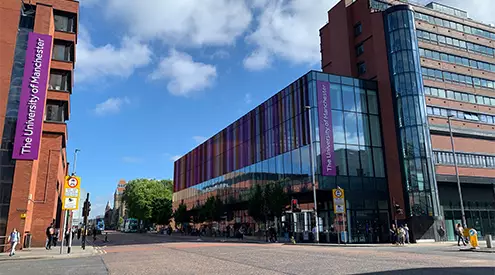 A view of the Alliance Manchester Business School looking down Oxford Road towards the main campus of the University of Manchester