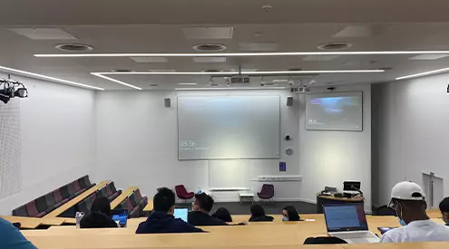 The inside of the ground floor lecture theatre at Alliance Manchester Business School