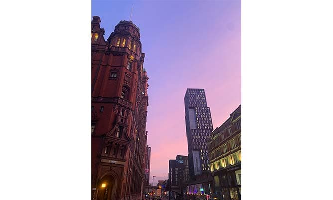 A view of the Palace Hotel in Manchester at sunset