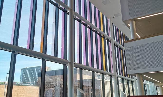 The Eddie Davies Library at Alliance Manchester Business School during the day looking out over Oxford Road