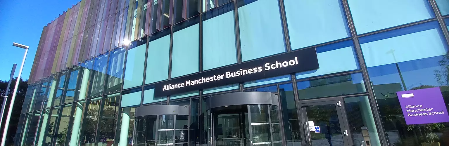 The front of the Alliance Manchester Business School building taken from floor level